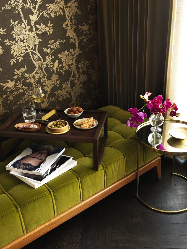 Breakfast on a green velvet bench in the Urban Suite